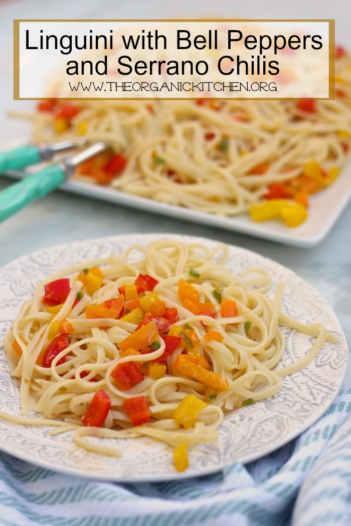 Linguini with Sweet Bell Peppers and Serrano Chili on a white plate in the foreground and on a white platter in the background