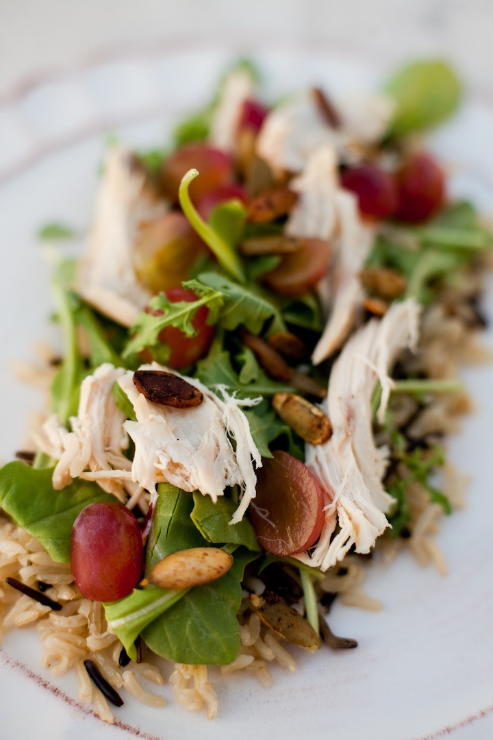 Wild Rice and Arugula Chicken Salad with Pear Chardonnay Vinaigrette on a white plate 