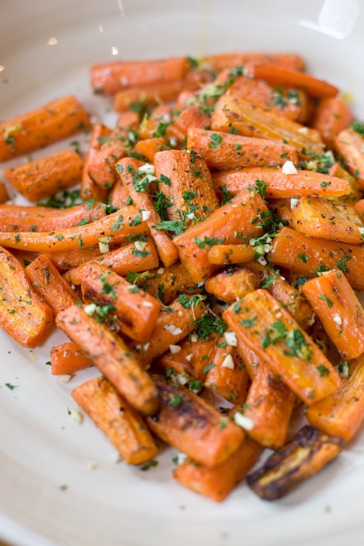 Roasted carrots with gremolata in a white bowl as part of  12 Healthy Whole30 Vegetable Side Dishes!