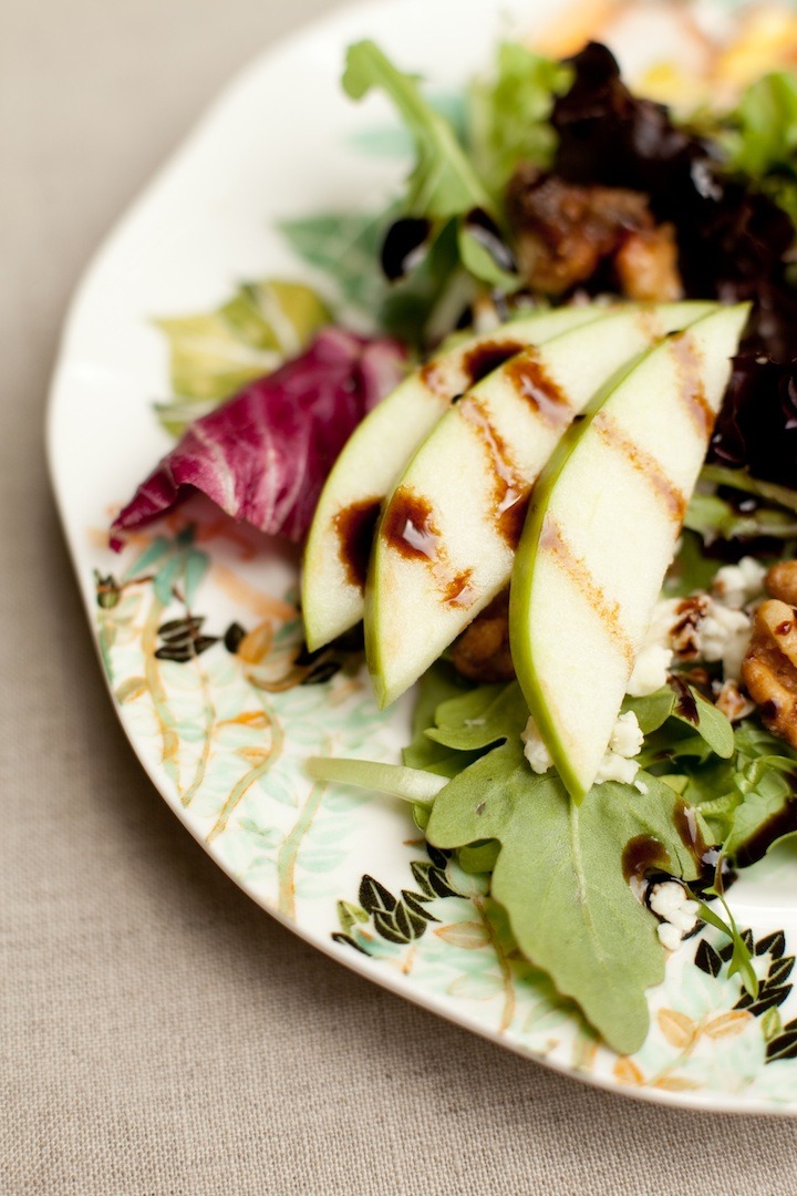 House Salad with apples on china set on tablecloth