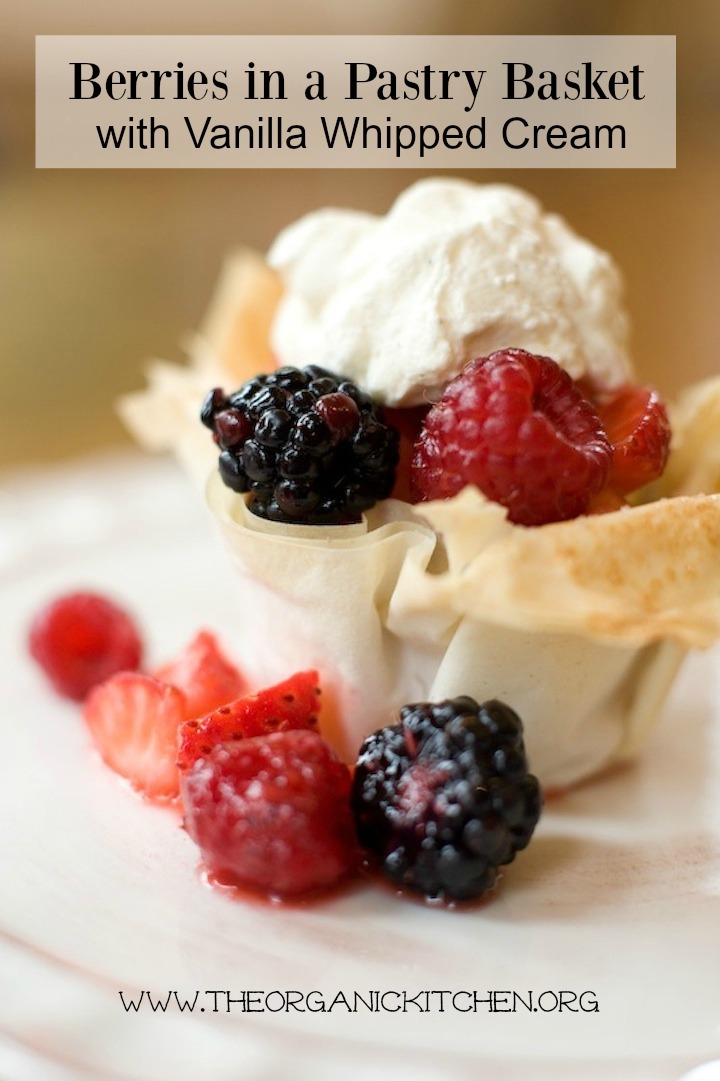 Berries in a Pastry Basket set on a white plate and topped with whipped cream