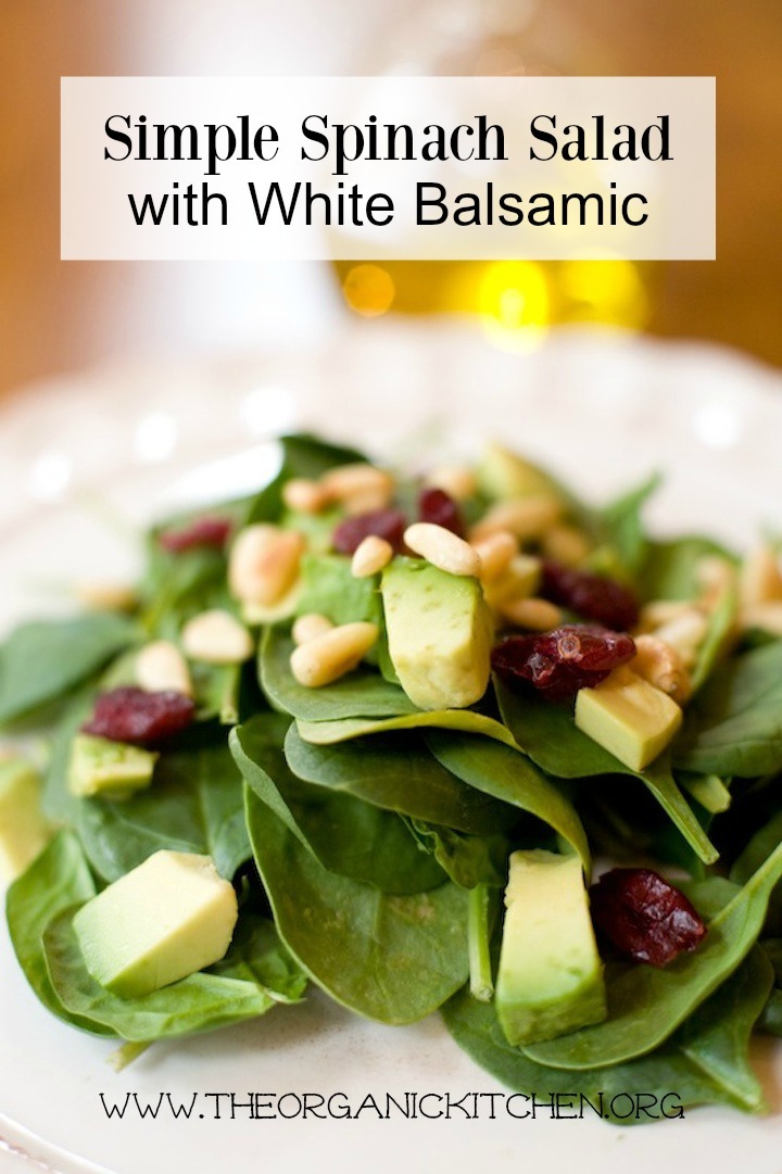 Simple Spinach Salad with White Balsamic on a white plate 