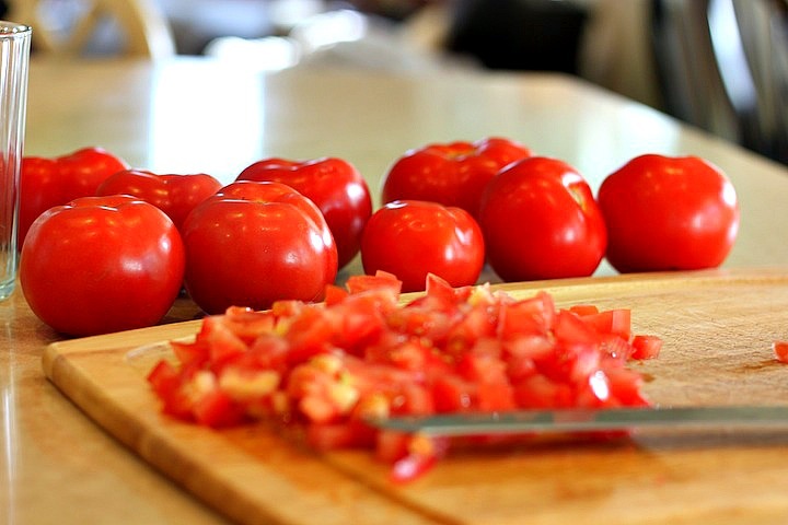Diced tomatoes on cutting board for Easy Tomato Bruschetta 