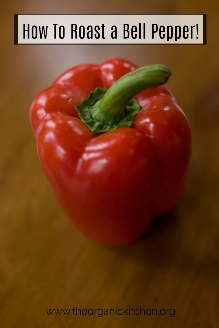 A red bell pepper sitting on a brown table: How to Roast a Red Bell Pepper