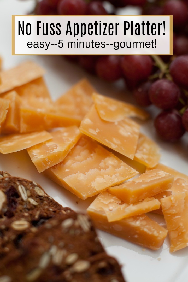 Cheese, grapes and crackers on a white plate: No Fuss Appetizer Platter