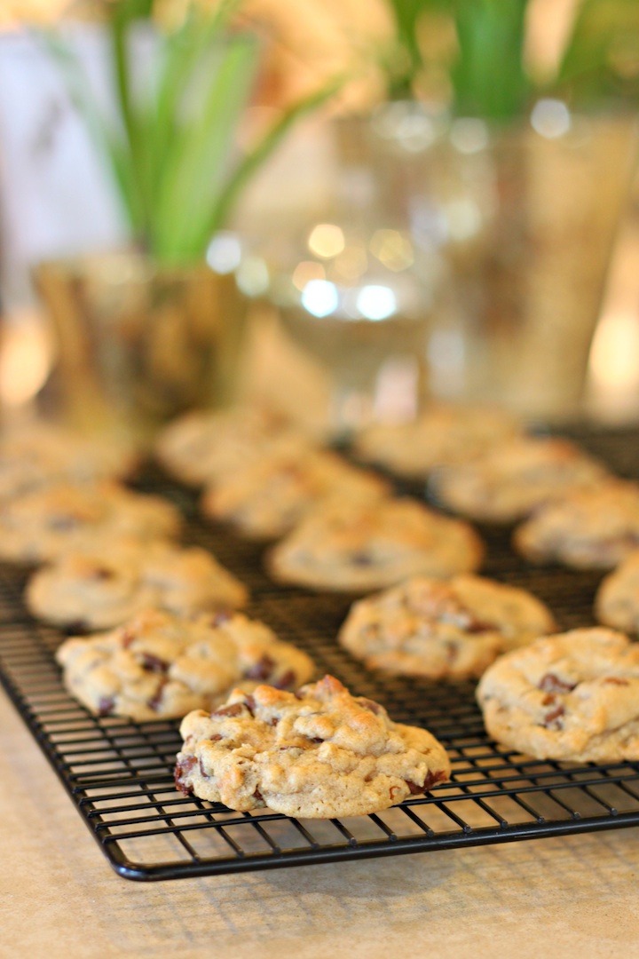 Baked Chocolate Chip Oatmeal Cookies with Orange Glaze on a cooling rack