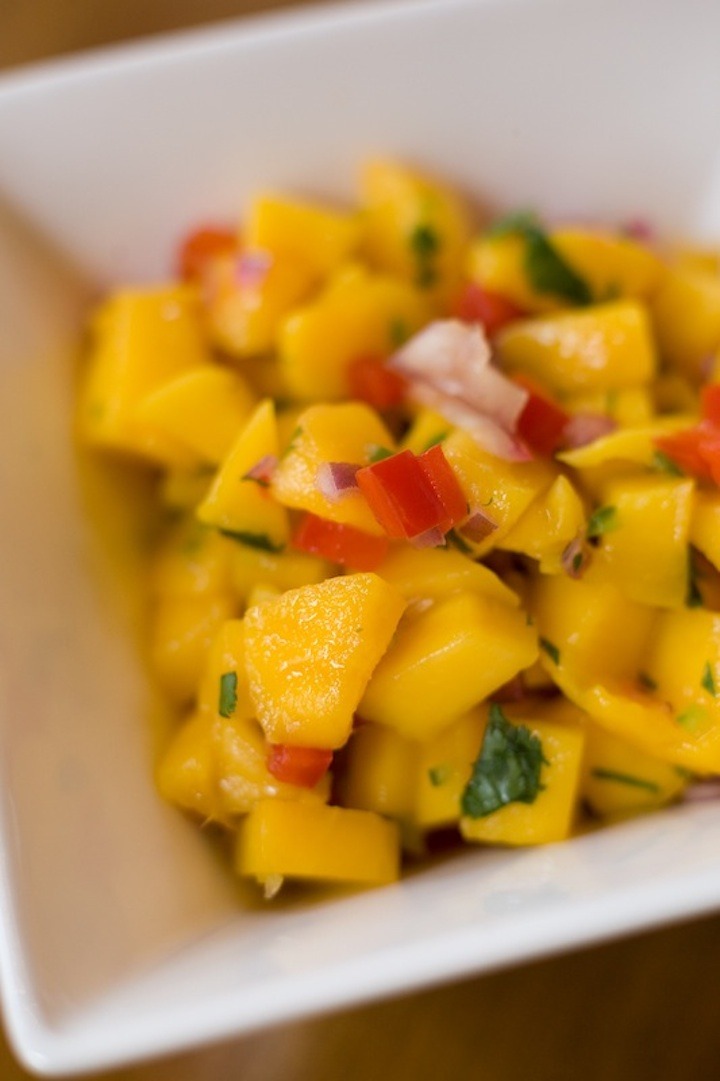 A white bowl of mango salsa for Air Fryer Hot Honey Chicken