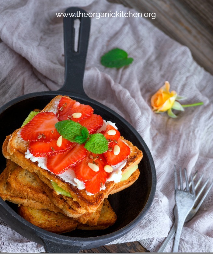  French Toast with Berries and Cottage Cheese in a black skillet 