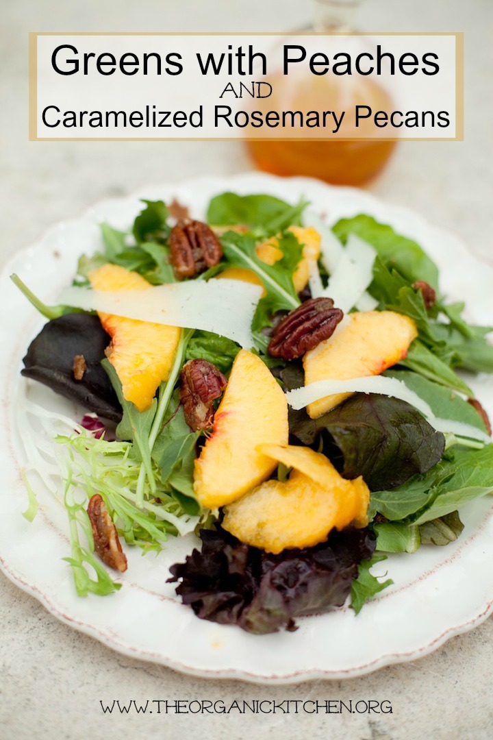 A white plate with Green Salad with Peaches, caramelized nuts, and Manchego Cheese