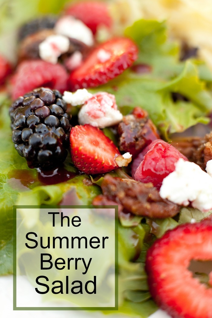 A close ip of my Summer Berry Salad with goat cheese, caramelized nuts, and raspberry vinaigrette