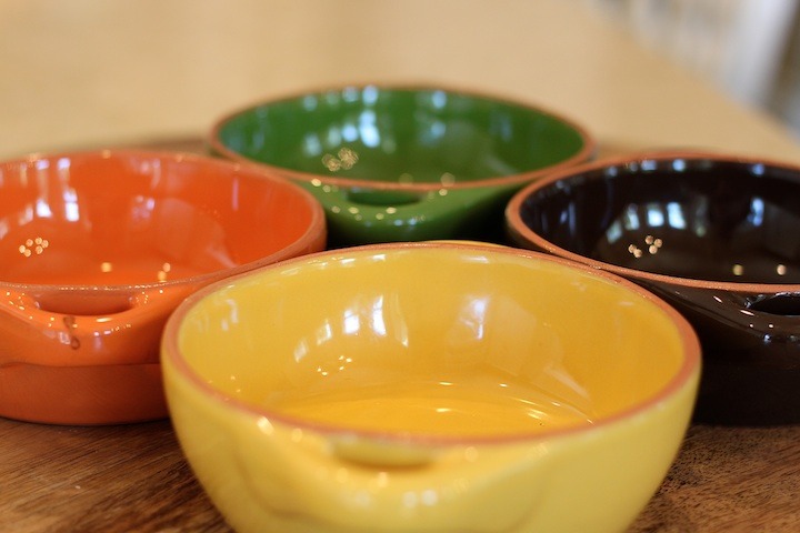 Four colorful ceramic baking dishes for Cheesy Baked Penne Rigate with a Kick!