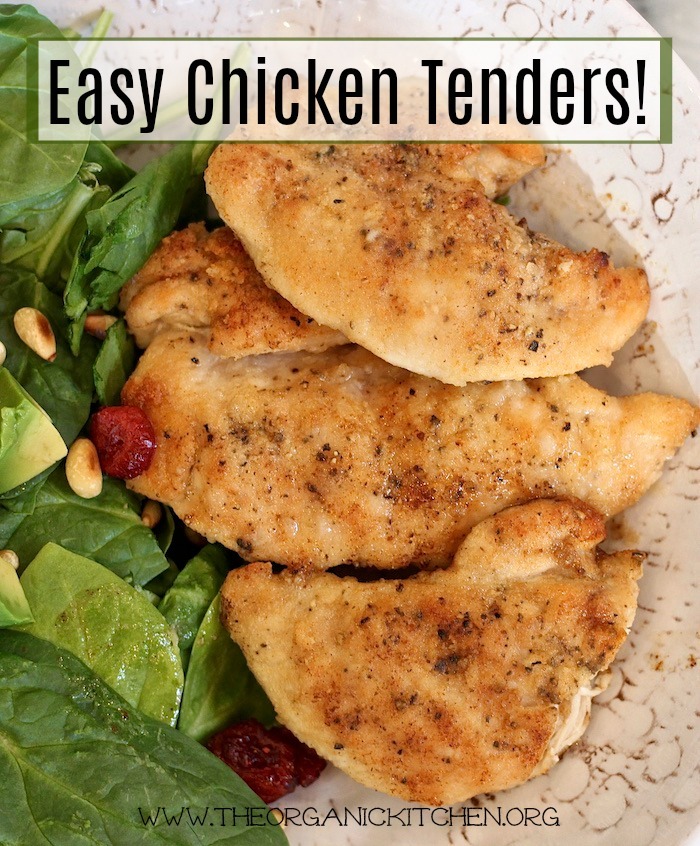 Three Easy Chicken Tenders in a white bowl nestled next to a green salad