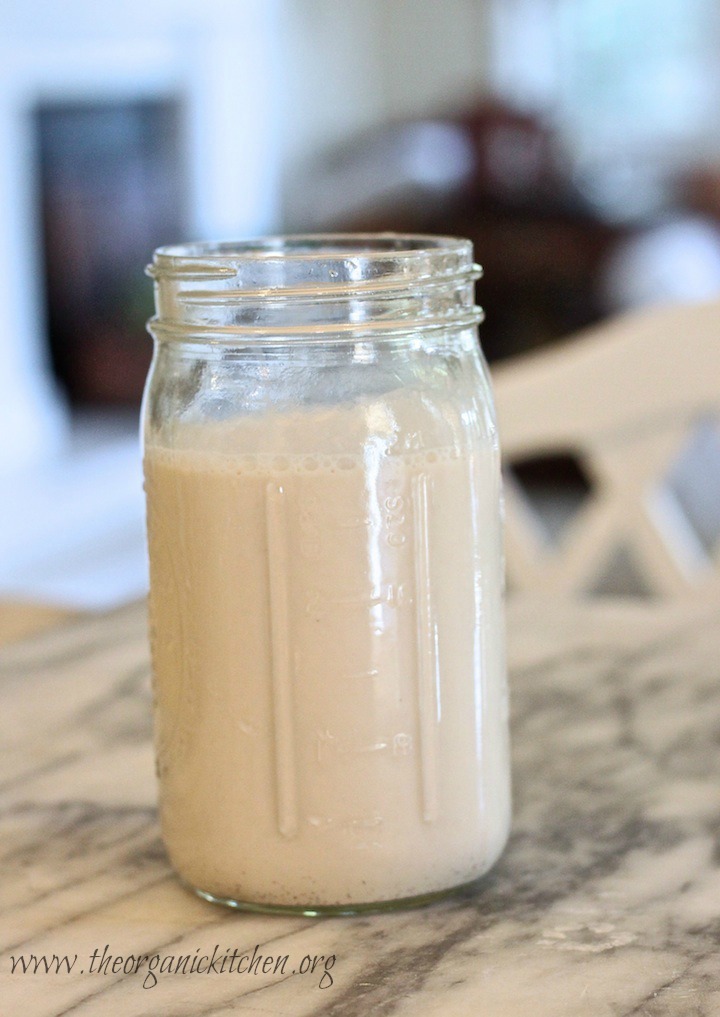 Dairy Free "Creamy Dreamy Strawberry Breakfast Smoothie" A jar of homemade vanilla almond milk on marble counter: Dairy Free "Creamy Dreamy Strawberry Breakfast Smoothie"