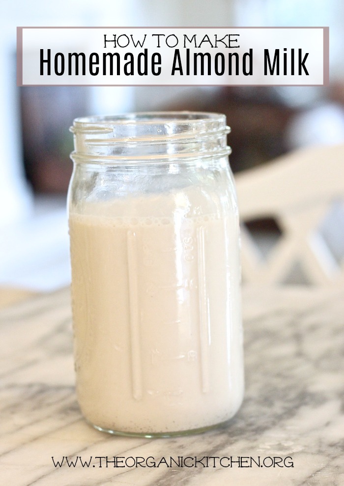 How to Make Almond Milk: a mason jar full of almond milk on a marble counter