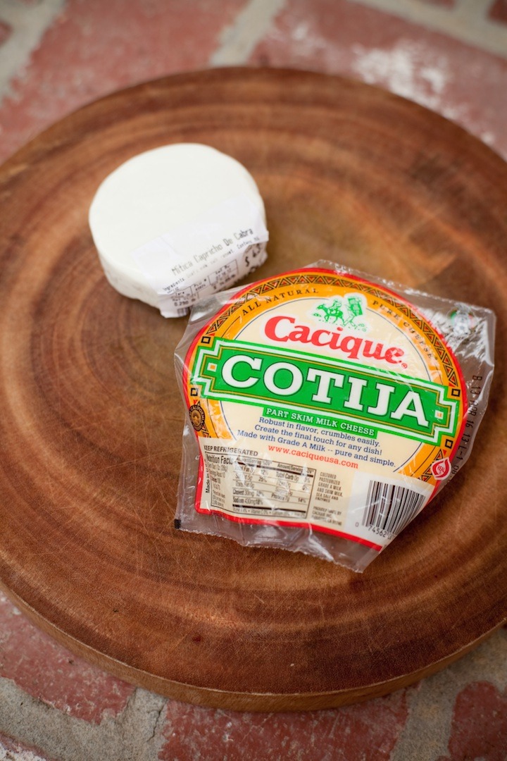 Cotija cheese on round cutting board to be used for making Mexican Street Corn from The Organic Kitchen