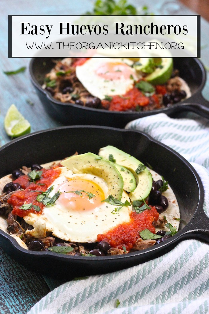 Two small cast iron skillets with Easy Huevos Rancheros on blue wood table