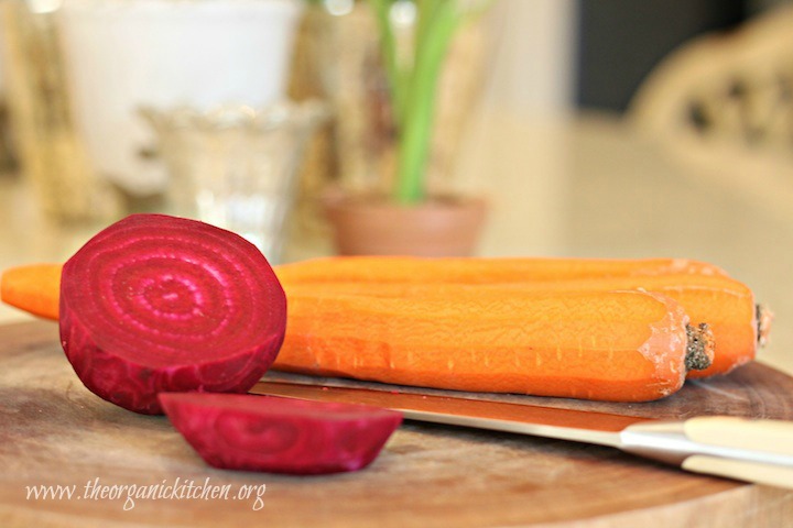 Raw carrots and beets on cutting board. Roasted Beet and Carrot Salad with Lemon White Balsamic Vinaigrette 