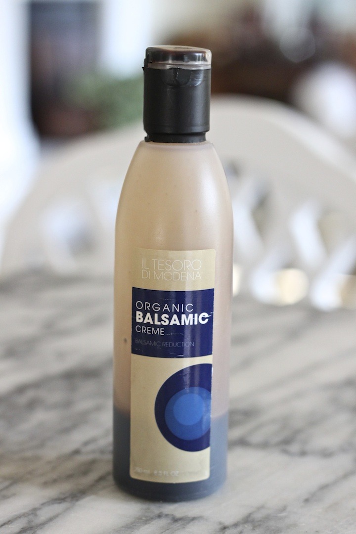 A bottle of balsamic glaze used to drizzle on Deconstructed Caprese Salad Party Platter