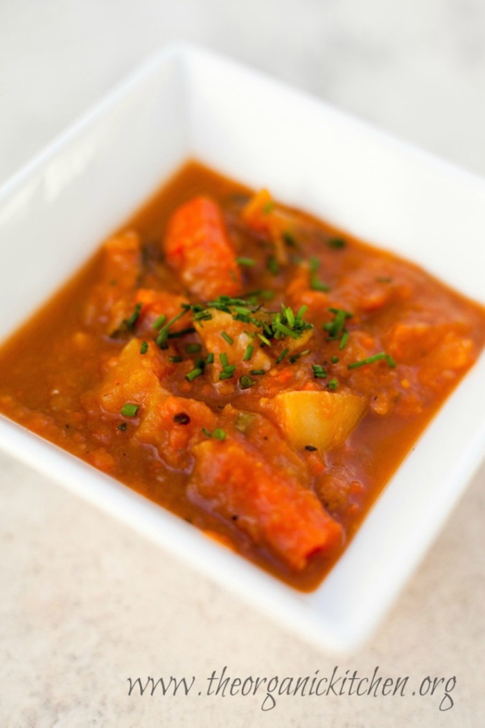 Roasted Vegetable Soup in white bowl on marble table top