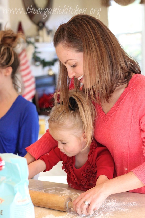 A mother and child rolling Traditional Rolled Sugar Cookies