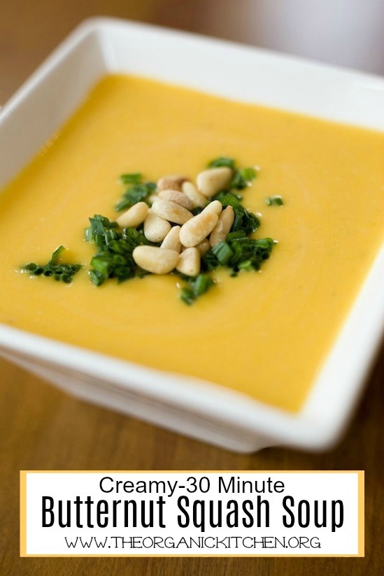 Creamy Butternut Squash Soup with a Paleo/Whole 30 option garnished with chives and pine nuts in white bowl