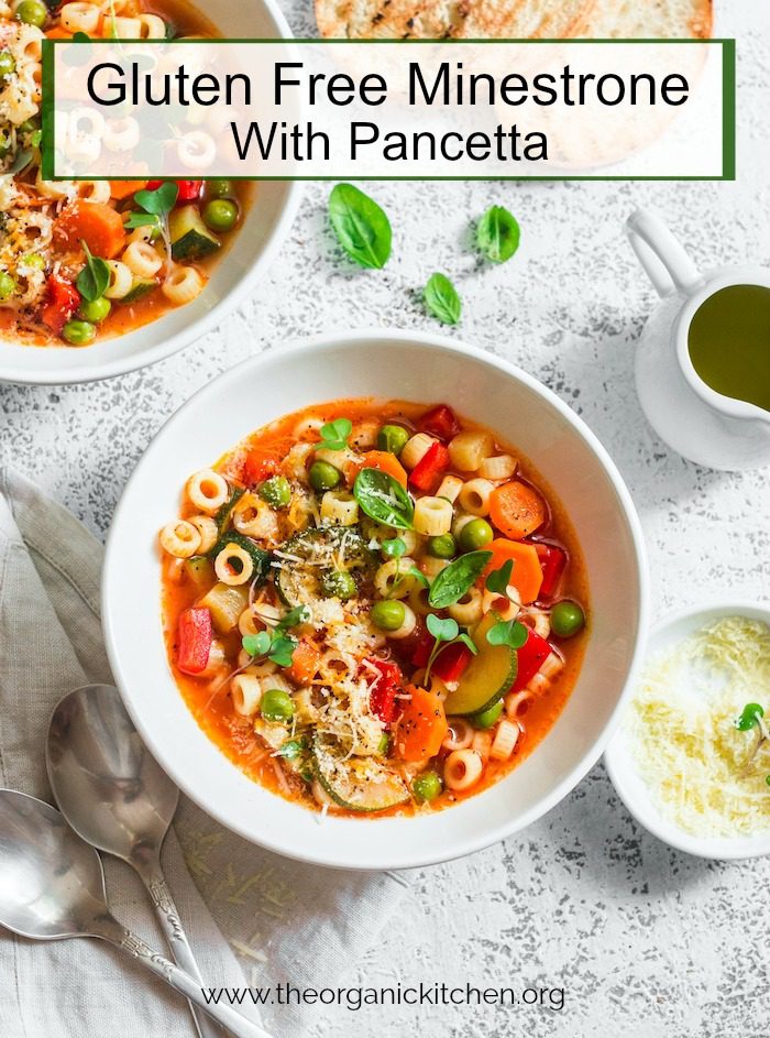 Gluten Free Minestrone with Pancetta in a white bowl on white table
