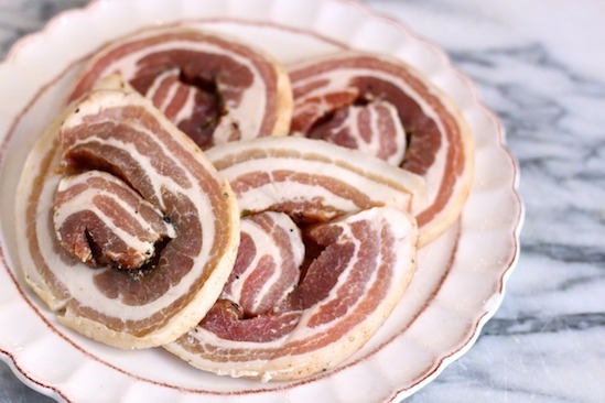 Pancetta on a white plate to be used in the making of Gluten Free Minestrone Soup