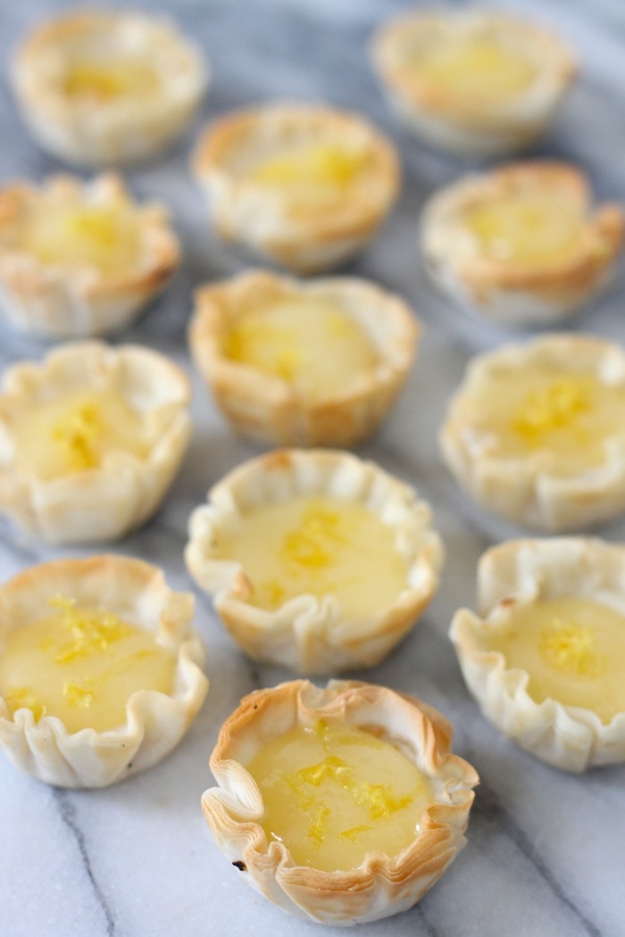 Mini Lemon Cheesecakes on marble surface