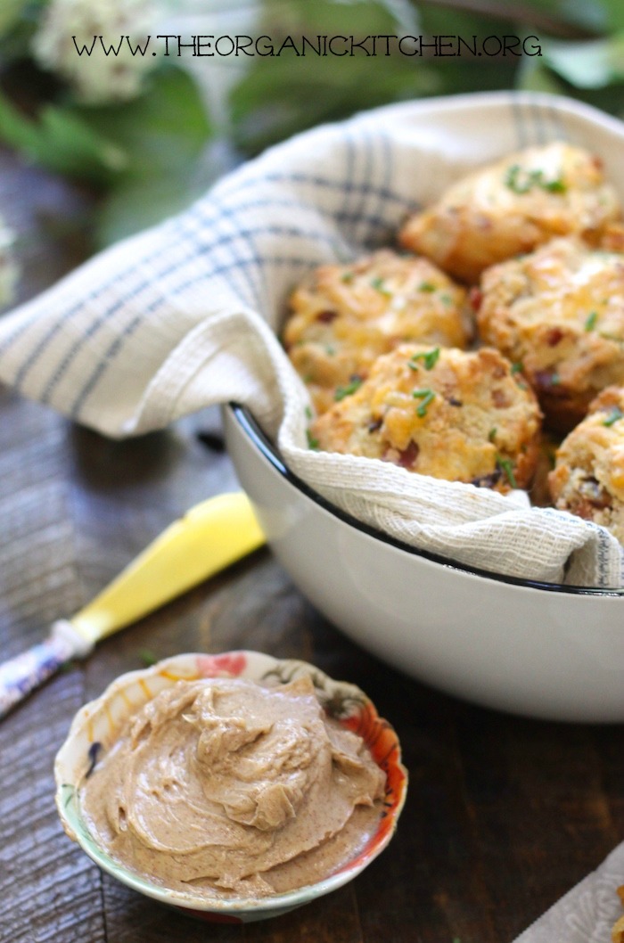 Cheddar Bacon Biscuits with Maple Cinnamon Butter in bowls on a wood surface