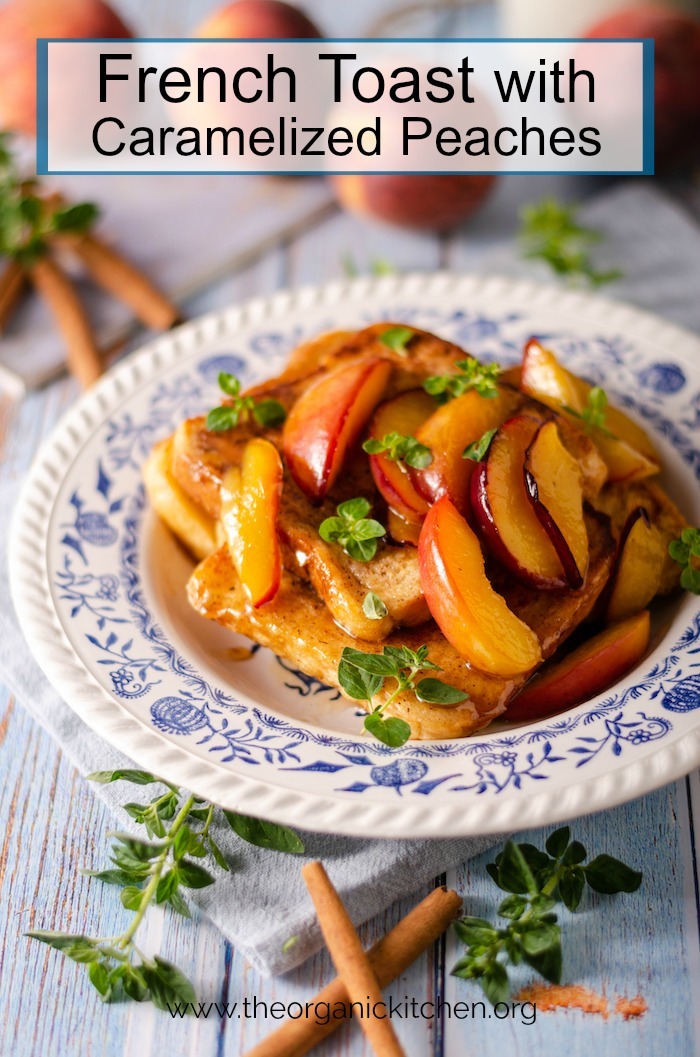 French Toast with Caramelized Peaches on blue and white plate surrounded by cinnamon sticks and greens