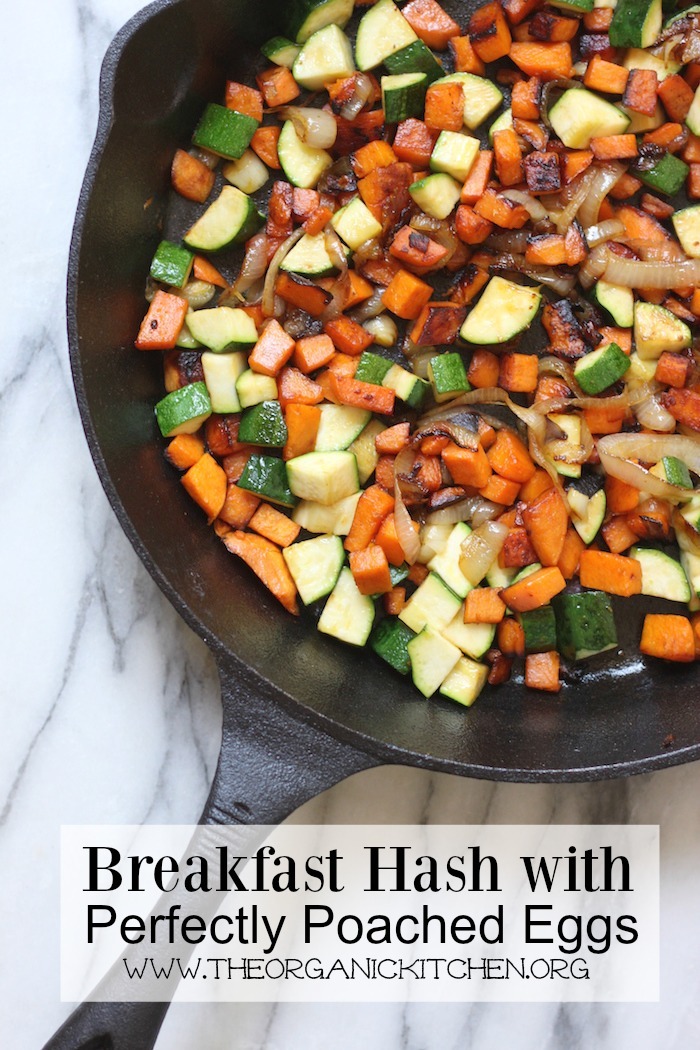 Breakfast Hash with Poached Eggs in a large black cast iron skillet