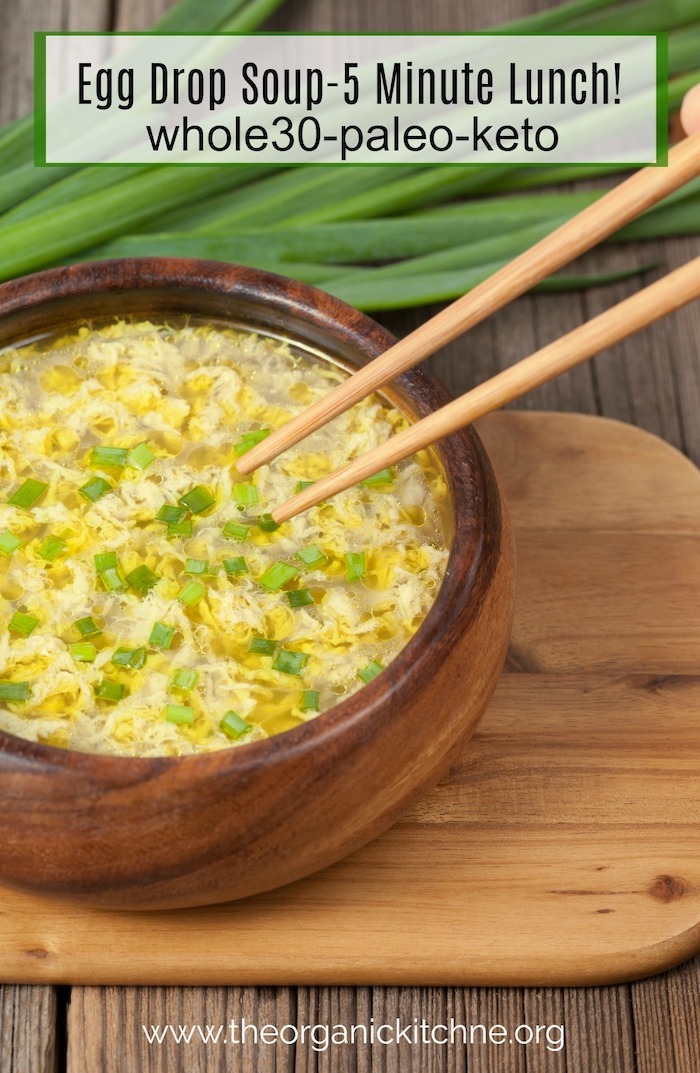 Egg drop Soup with chop sticks in a wooden bowl