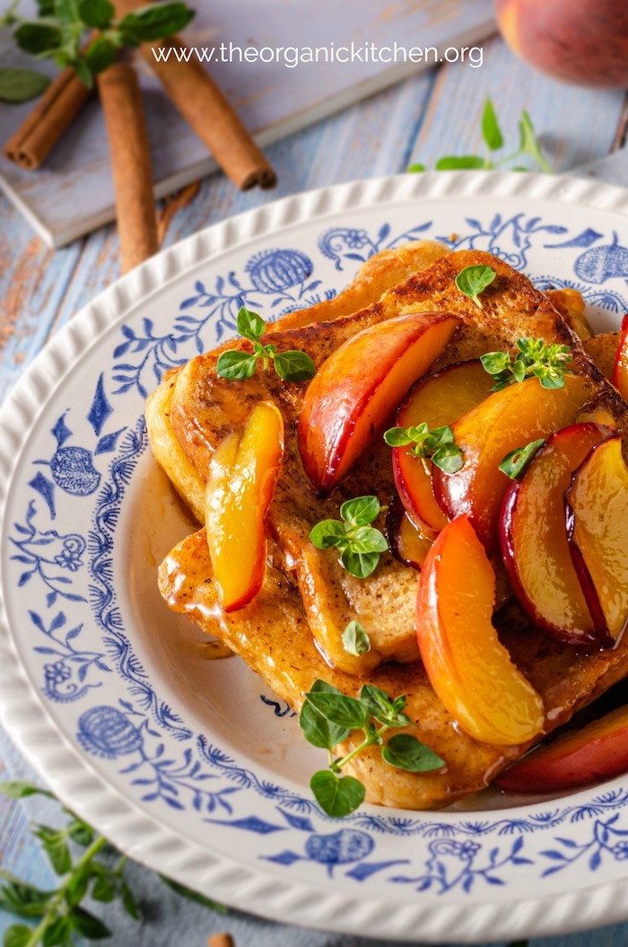 Close up of French Toast with Caramelized Peaches garnished with herbs 