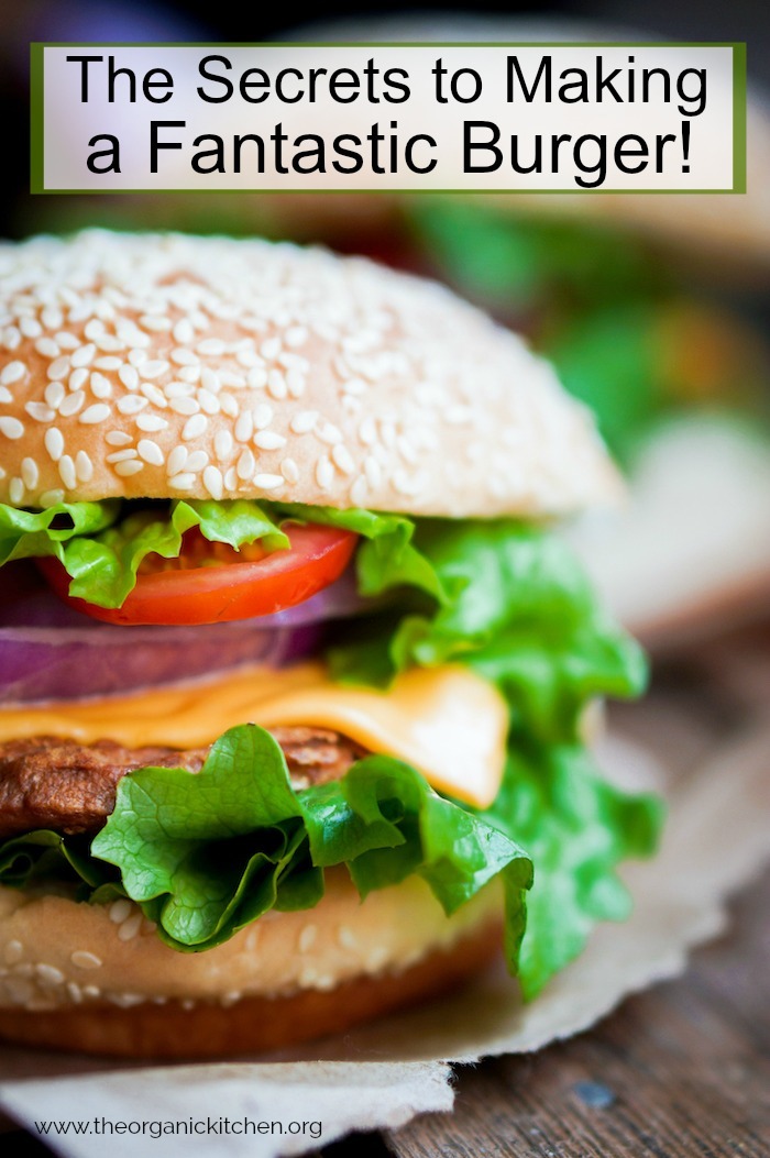 A beautiful burger with lettuce, cheese and onions as part of The Secrets to Making a Fantastic Burger!