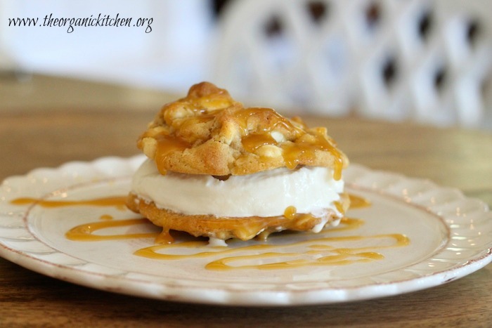 The Organic Kitchen Ice Cream Sandwich drizzled with salted caramel on a white plate