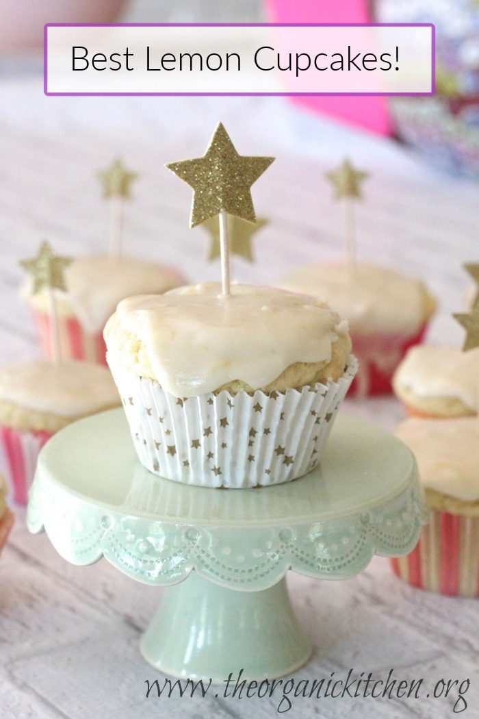 The Best Ever Lemon Cupcakes with Lemon Glaze The Best Ever Lemon Cupcakes with Lemon Glaze on green cake palte with star candles on top