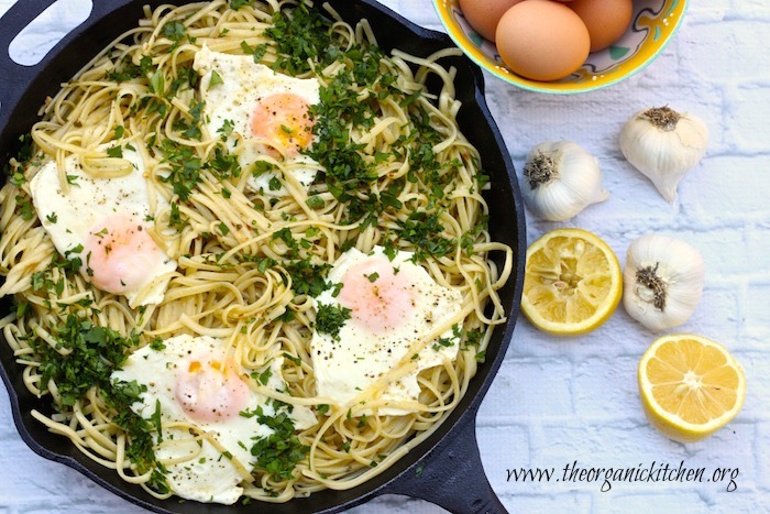 Pasta Aglio e Olio with Sunnyside Up Eggs from The Organic Kitchen in black cast iron skillet