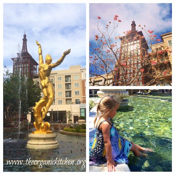 Americana at Brand A three picture collage of Americana at Brand: a gold statue, a little girl dipping her feet in a fountain, and a building with spring flower in foreground
