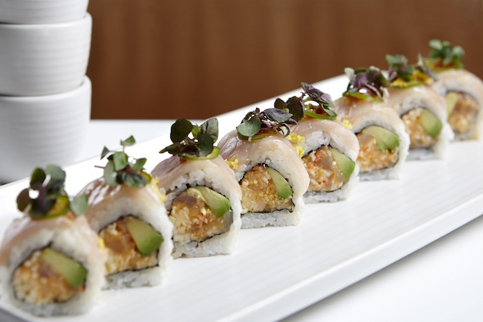 Double Hamachi sushi on white plate
