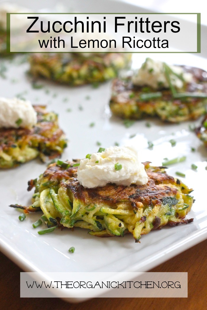 Four Zucchini Fritters with Lemon Ricotta (with Gluten Free Option) set on a white platter and sprinkled with chopped chives