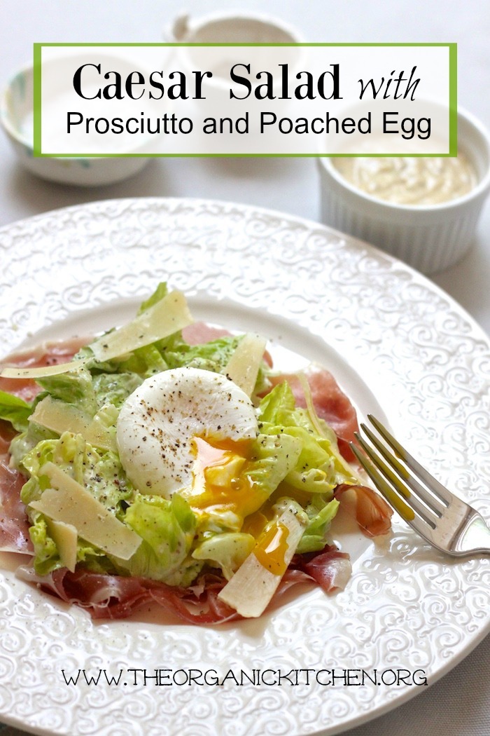 Caesar Salad with Prosciutto and Poached Egg on a white plate