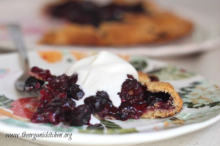 One slice od Blackberry Walnut Galette with whipped cream