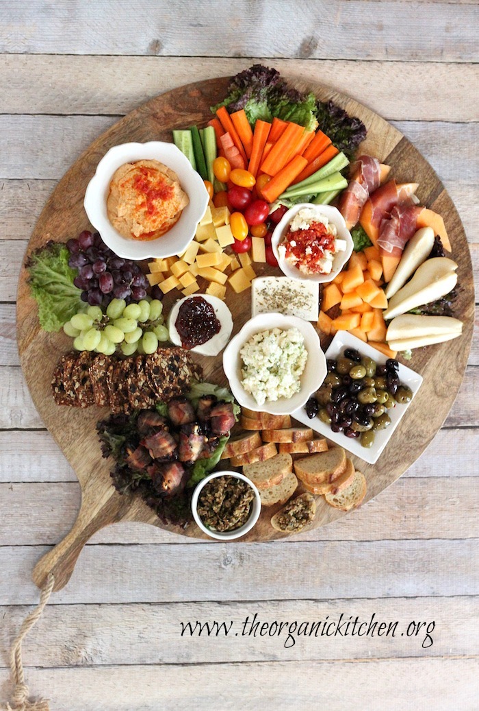 A platter of appetizers including Sun Dried Tomato Hummus