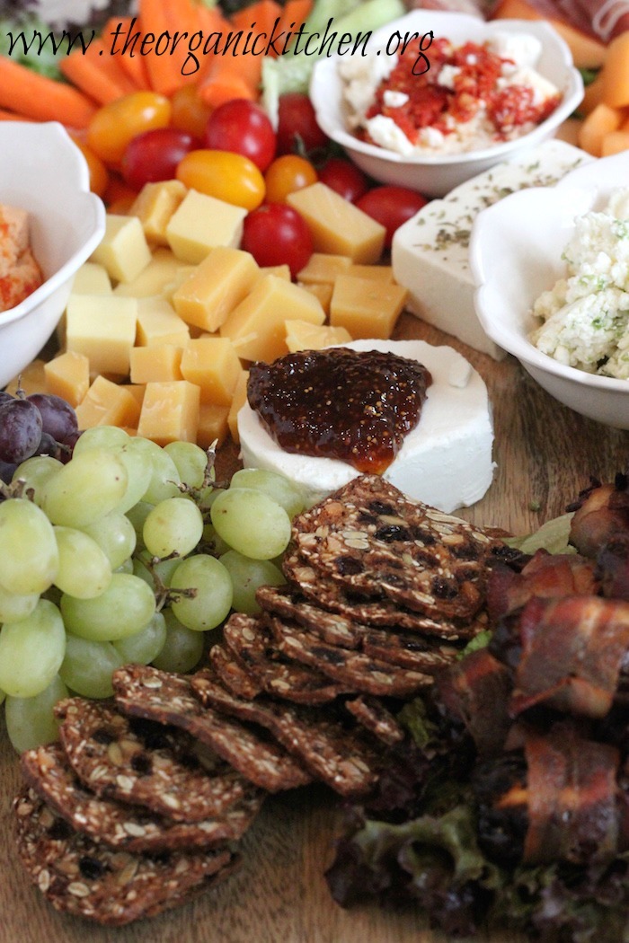 This is THE ultimate Mediterranean appetizer platter! It includes amazing spiced up cheeses like gouda and feta along with hummus, tapenade and bacon wrapped dates! It's perfect for your next dinner party.