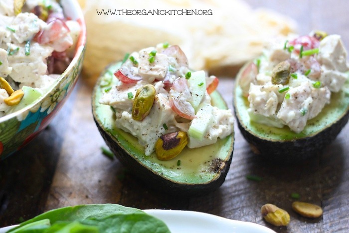 Two avocado halves filled with The Best Homemade Chicken Salad!