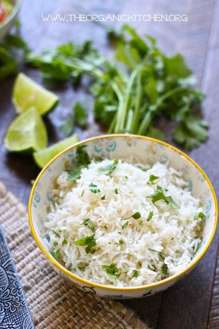 A bowl of Cilantro lime rice to be used as a side dish for Pulled Pork Tacos with Cilantro Lime Rice (Crock Pot or Instant Pot!)