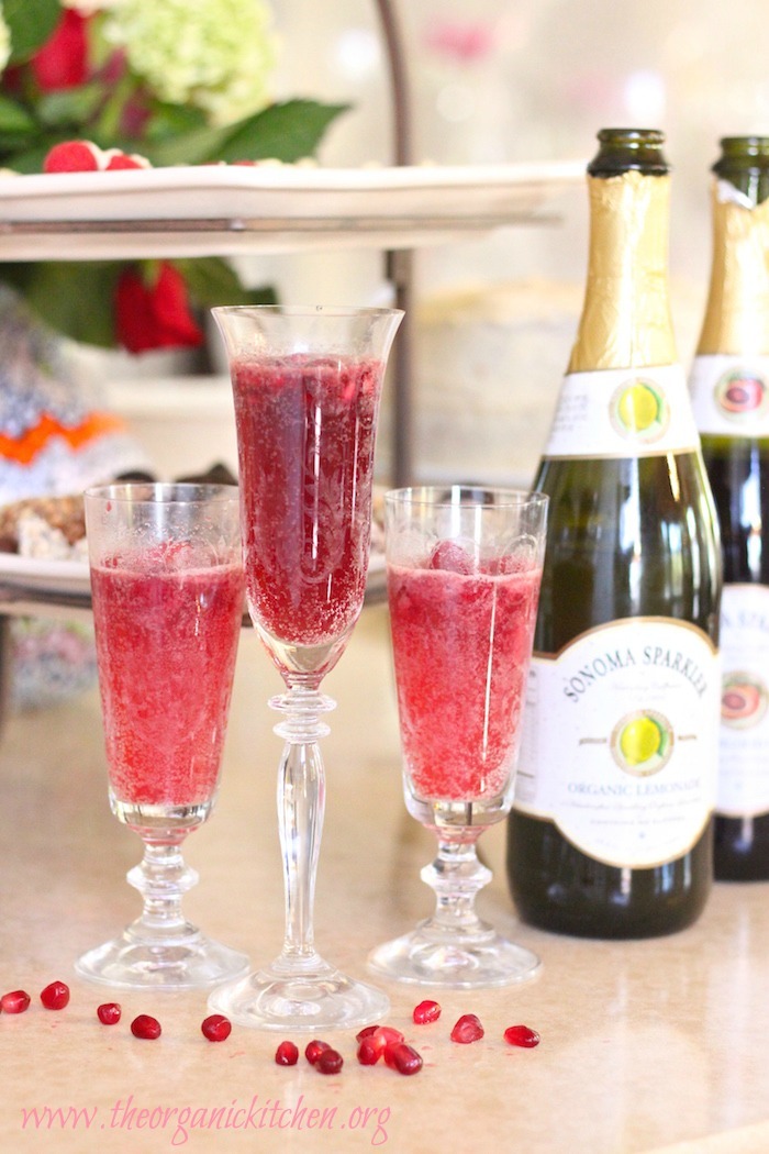 This citrus sparkler is the perfect non-alcoholic party drink! It includes options for a raspberry lemon sparkler and a pomegranate blood orange sparkler, using sorbet in a Bellini style drink worthy of a fancy glass.