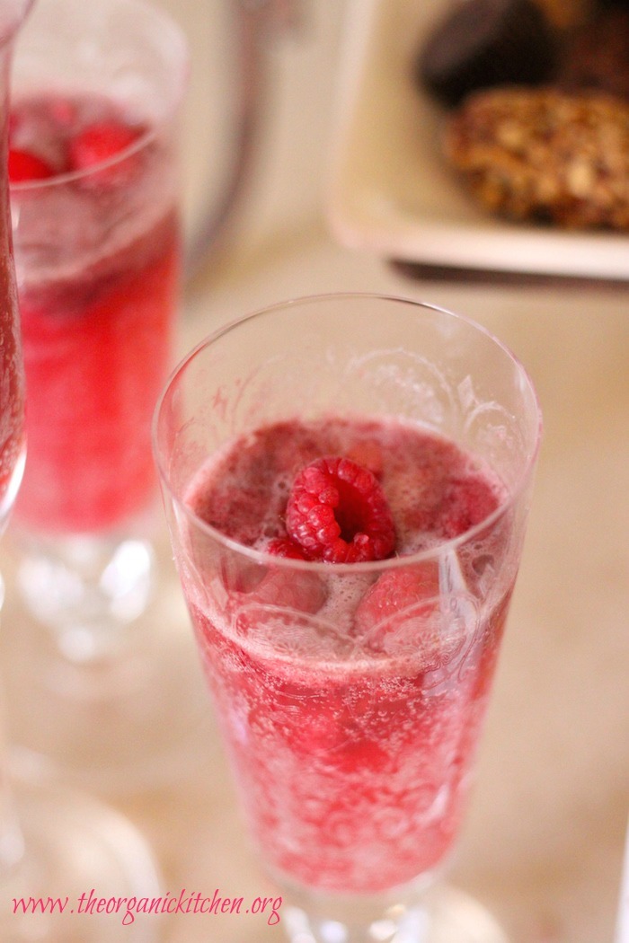 This citrus sparkler is the perfect non-alcoholic party drink! It includes options for a raspberry lemon sparkler and a pomegranate blood orange sparkler, using sorbet in a Bellini style drink worthy of a fancy glass.