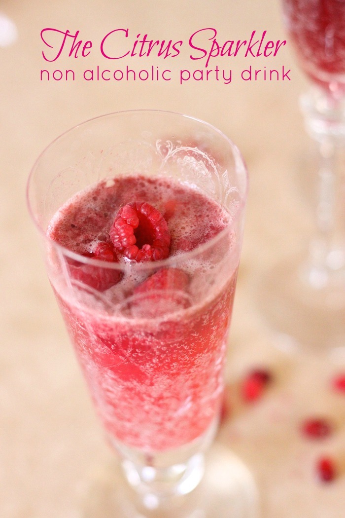 This citrus sparkler is the perfect non-alcoholic party drink! It includes options for a raspberry lemon sparkler and a pomegranate blood orange sparkler, using sorbet in a Bellini style drink worthy of a fancy glass.
