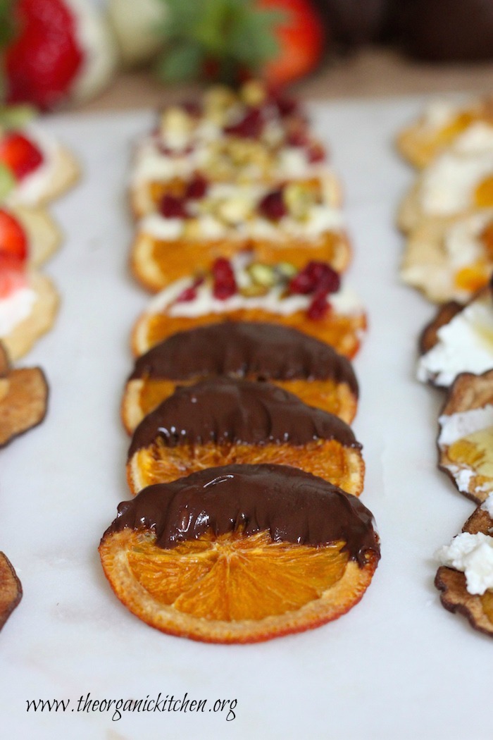 Dried oranges dipped in chocolate as part of a Fruit, Chocolate and Cheese Dessert Platter